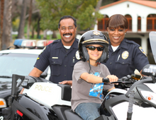 Riverside Police Department with Child on Motorcycle